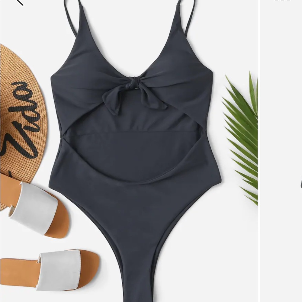 Never worn one piece open front bathing suit